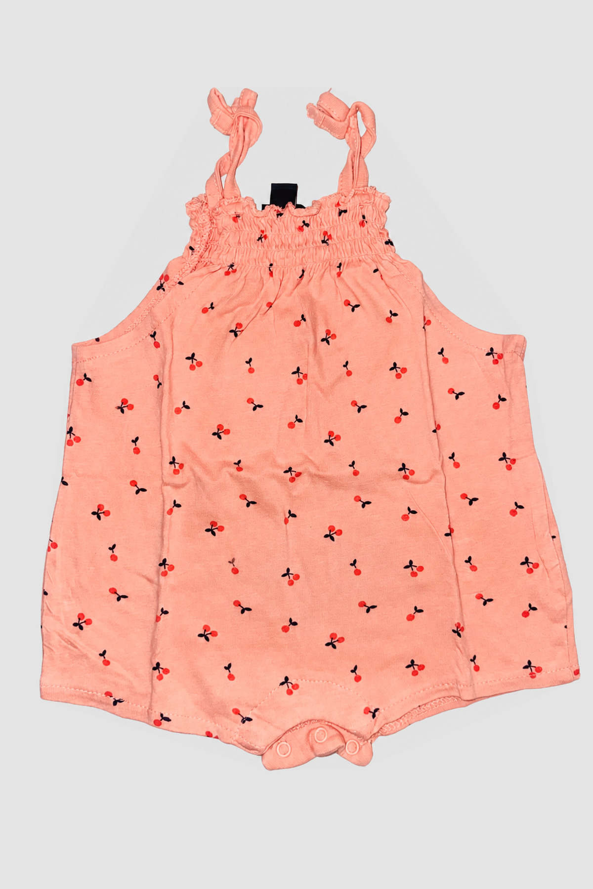 Barboteuse bébé corail à petits motifs cerises