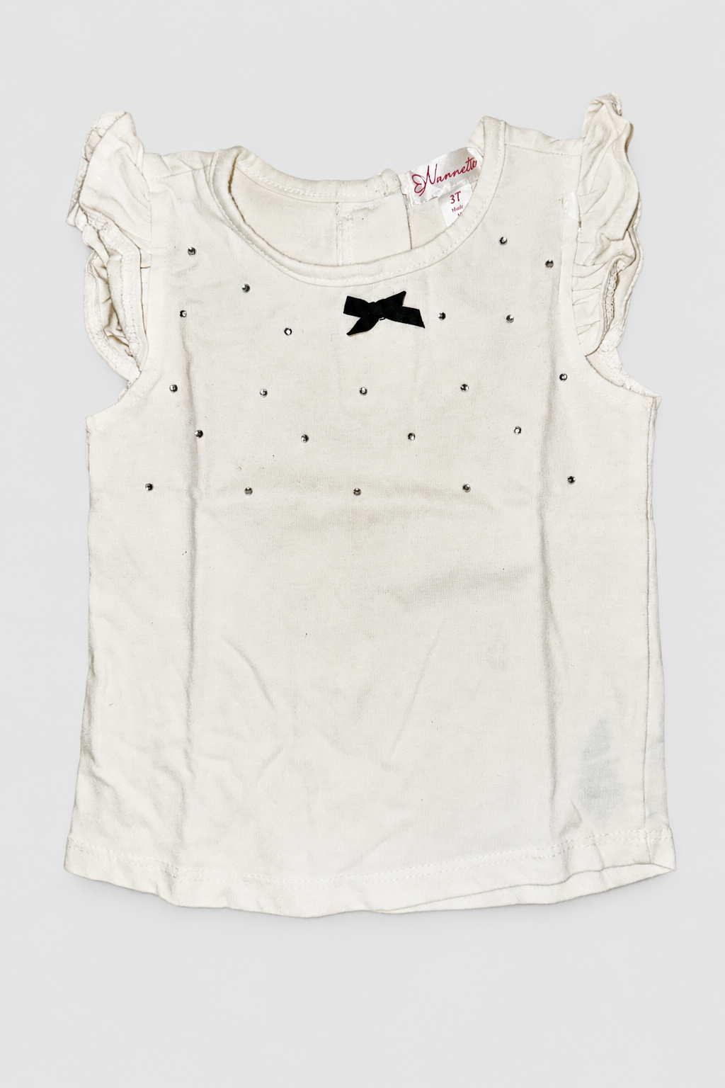 Seconde main – Haut blanc à strass et nœud noir