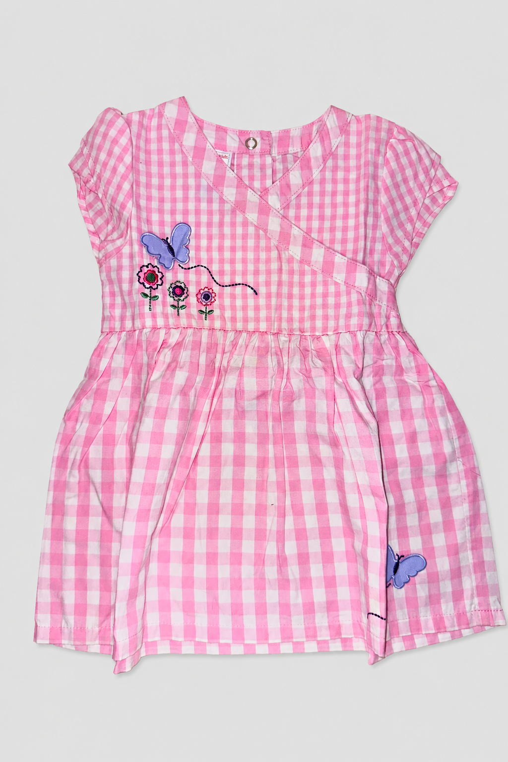 Robe rose à papillons brodés