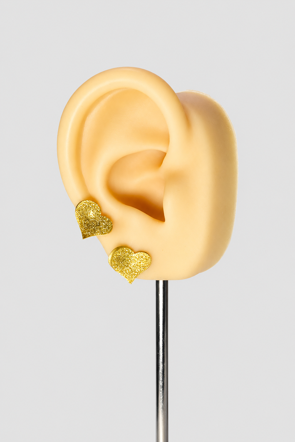 Boucles d’oreilles dorées à cœurs texturés