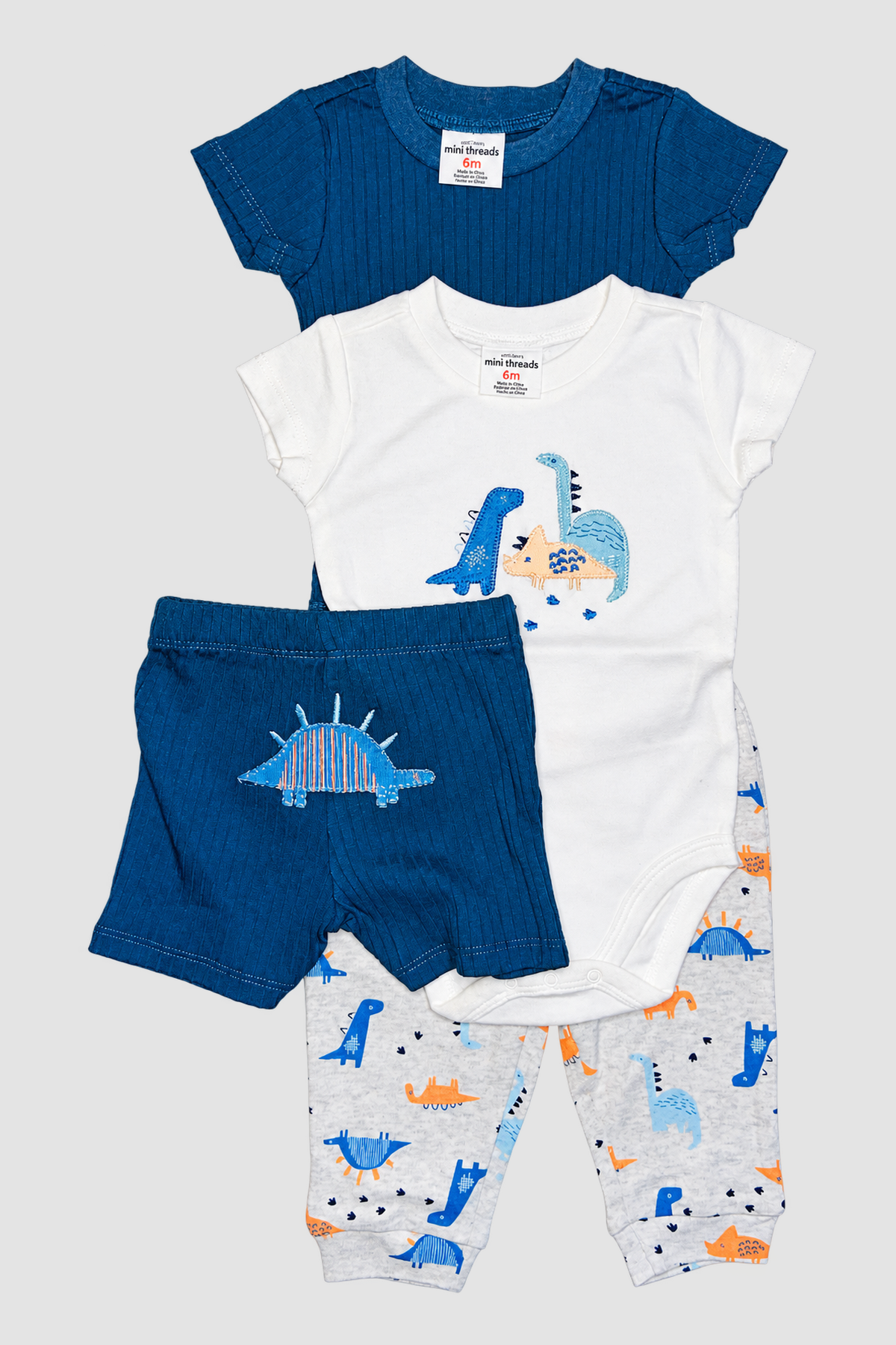 Ensemble bébé Petit Lem 4 pièces à dinosaures : T-shirt bleu marine, body blanc, short et pantalon imprimé