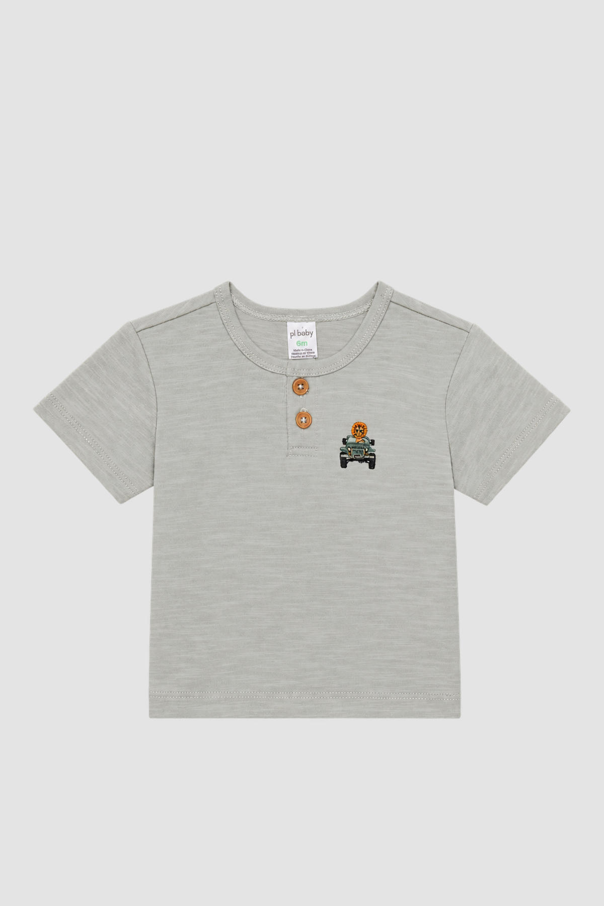Haut clair Petit Lem avec boutons au col et petit motif lion dans un véhicule de safari