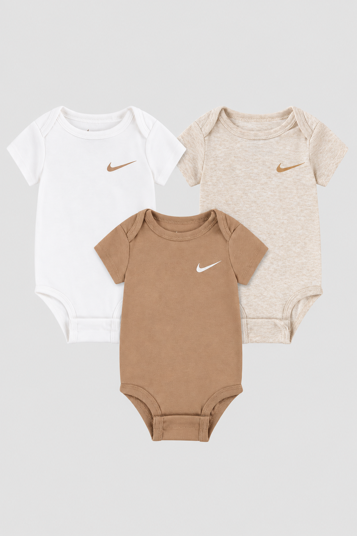 Lot de 3 bodies Nike blanc, beige et marron, taille 6 mois